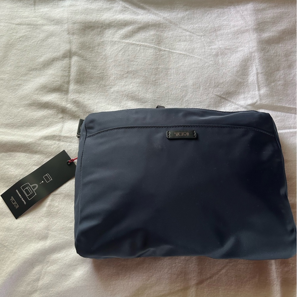 Tumi Blue Duffle Bag with Sleek Design and Durable Fabric